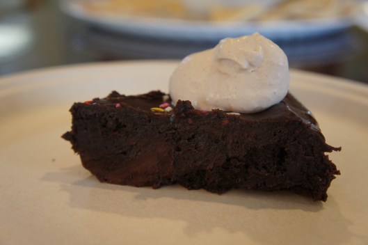Slice of Super Fudgy Flourless Chocolate Glazed Cake