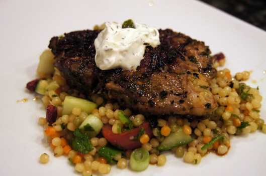 Rosemary Pan Seared Lamb Shoulder Chop served over rainbow couscous salad