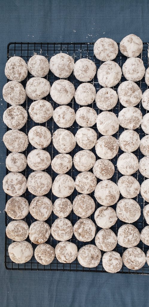 Pfeffernüsse Cookies with first coat of powdered sugar